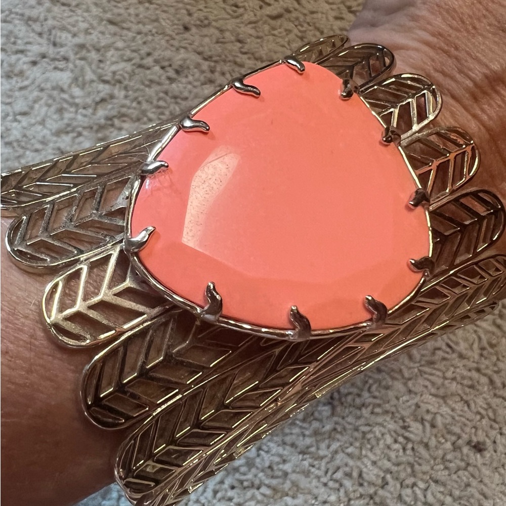 Kendra Scott gold cuff with tangerine stone